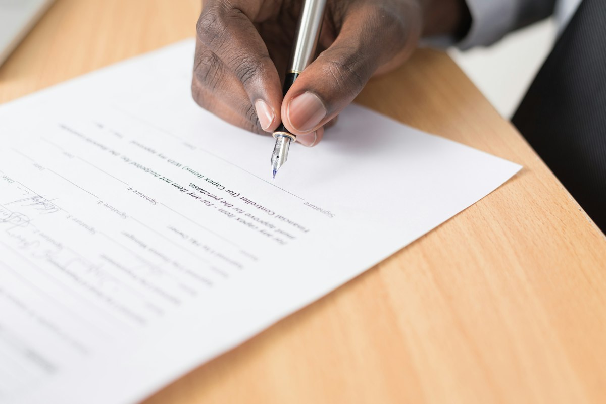 HOA board signing a new contract after deciding to change HOA management company